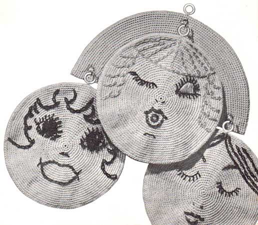 Three circular pot holders with embroidered faces