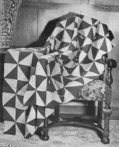 Modular knit blanket and cushion with triangle design