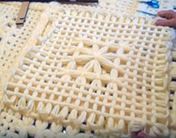 A daisy square made on the large butterfly loom