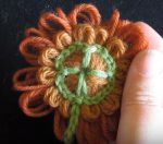 Loomed flower with shamrock crochet centre