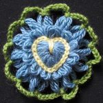 Loomed flower with heart crochet centre