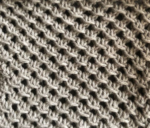 Knitted swatch in lattice stitch