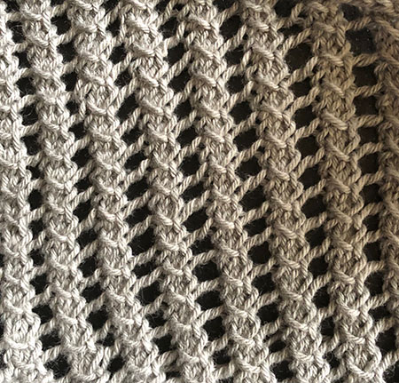 Knitted swatch in crossover stitch