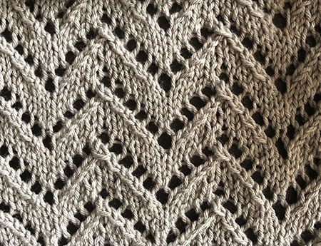 Knitted swatch in lace chevron stitch