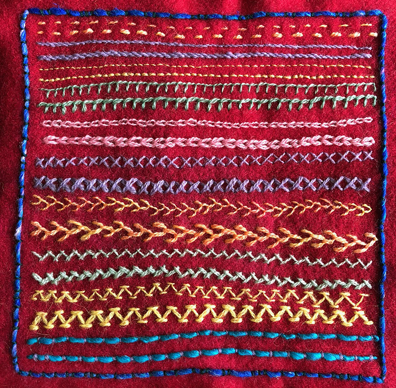 Wool blanketing sampler with various line stitches worked in wool thread.