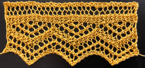 Hand knit lace edging with triangle and zig-zag design