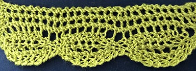 Knitted sample of a border with oval edge.