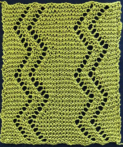 Knitted sample of a garter stitch insertion with two double rows of eyelets in a zig-zag or sawtooth pattern.