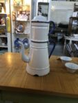 A white enamel coffee pot